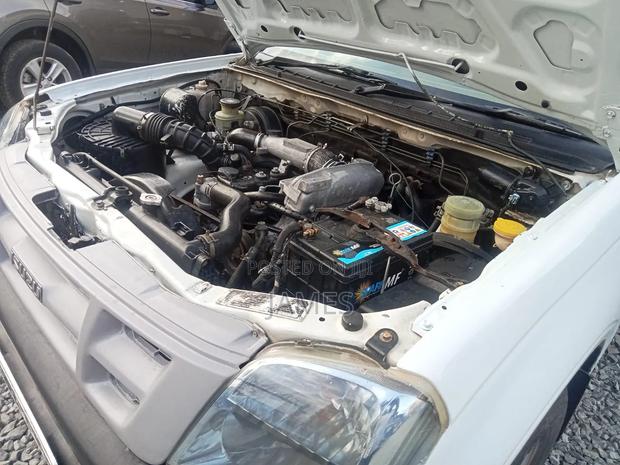 Isuzu Como 2014 White - thumbnail 2