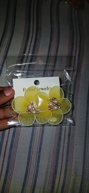 I Sell Cute Fluffy Bags,earrings and Ladies Sandals.