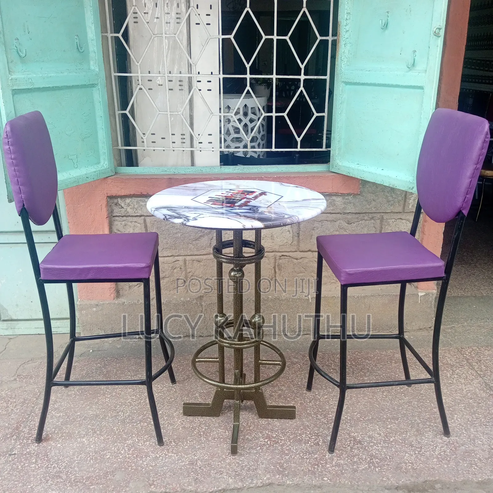Two Purple Curved Restaurant Chairs With Table