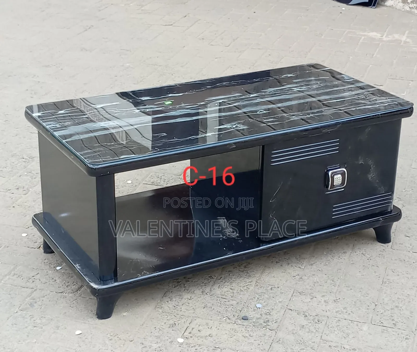 Modern Black Coffee Table Featuring a Sleek Marble