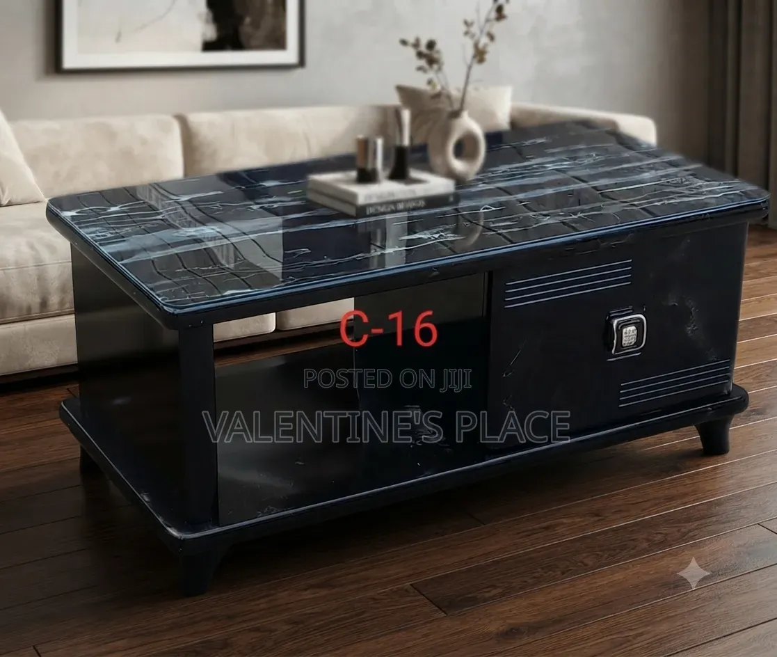 Modern Black Coffee Table Featuring a Sleek Marble