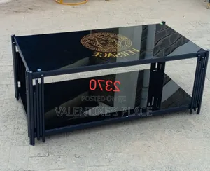 Modern Black Glass Coffee Table Featuring a Striking Versace