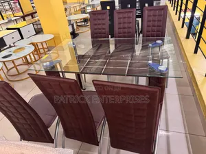 Glass Dining Set Six Seater With Distinct Red-Brown High-Back Chairs.