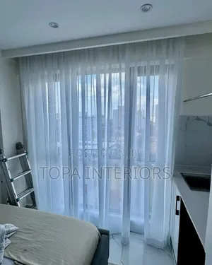 White Bedroom Sheer Curtains to Allow Light Into the Bedroom