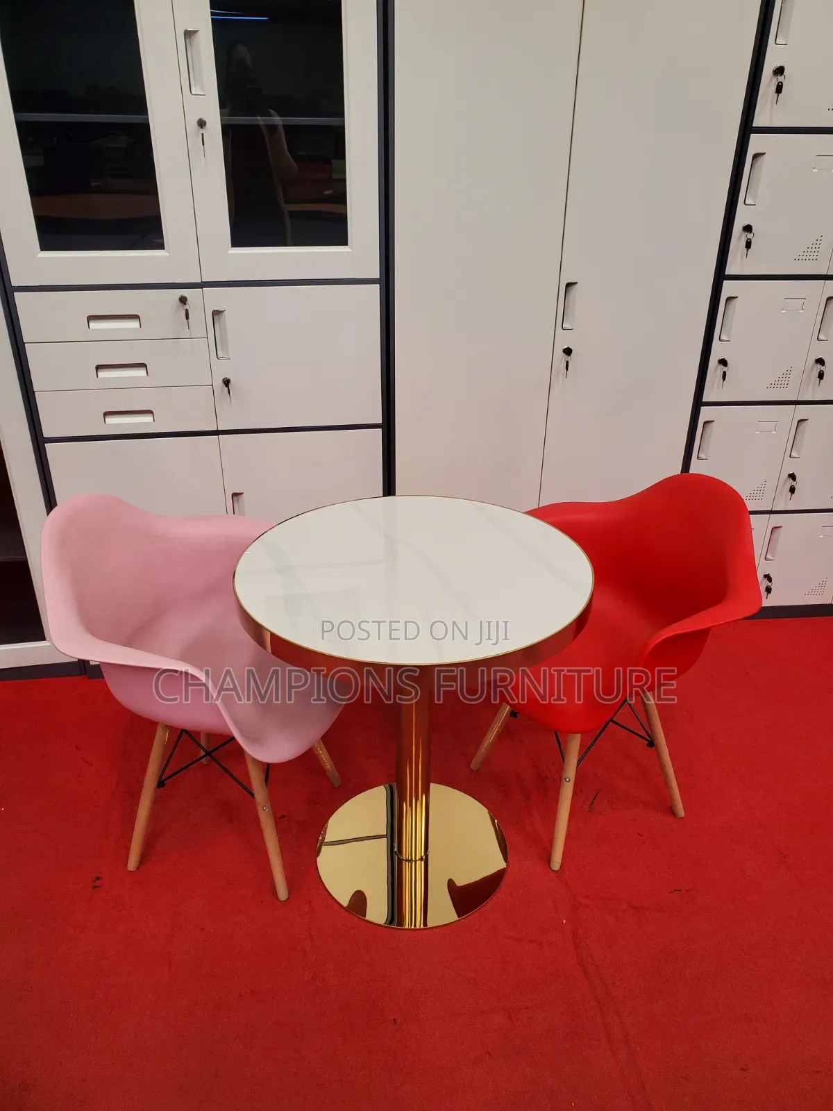 Gold Pedestal Table With Molded Shell Armchairs