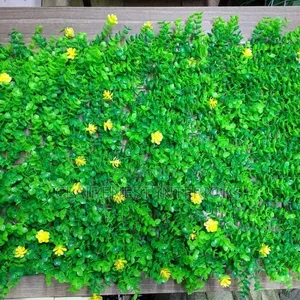 Green Boxwood Panels With Decorative Yellow Flowers