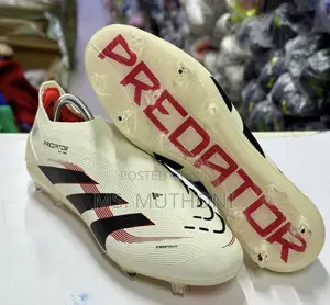 The Adidas Predator Elite Laceless FG Ruby Football Shoes