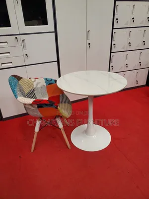 White Tulip Table and Patchwork Eames Chair